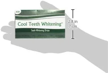 Cool  teeth whitening strips product packaging held in a hand with measurement indicators.